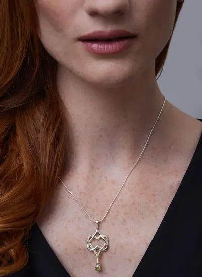 Close up shot of red haired model wearing Mo Chroi Love Pendant